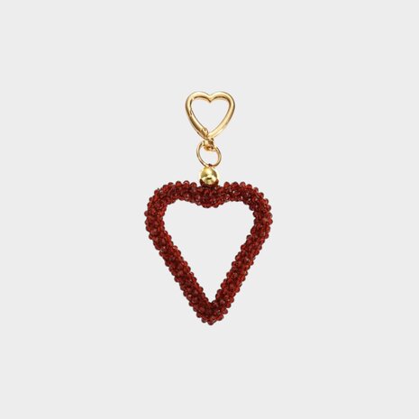 Gouden tas of sleutelhanger met bordeaux hart van glaskraaltjes lengte 13 cm